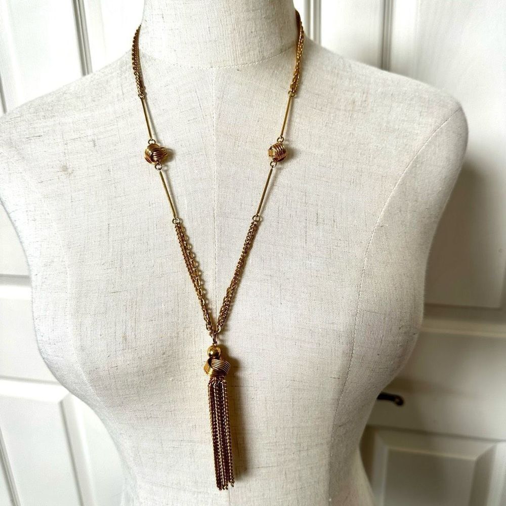 Gold tone knotted tassel necklace